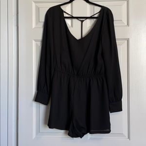 Long sleeve black shirt romper with open back